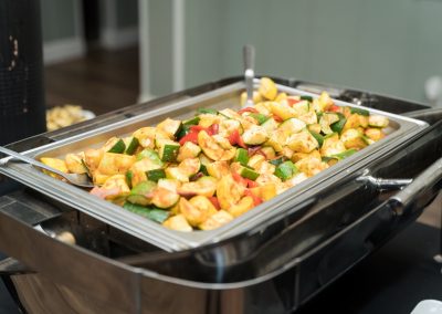 Chafing dish of grilled zucchini, squash and red peppers at a buffet