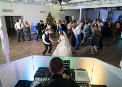 Guests fill the dance floor as the DJ plays at an evening reception