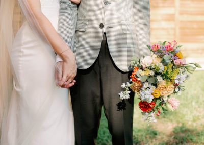 bride and groom holding hands with bouquet idlewood wedding events venue bartow florida