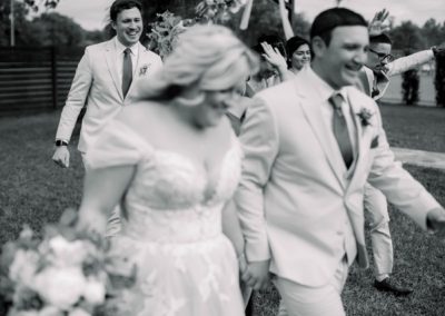 Close-up of a beaded bridal gown bodice and a delicate silver necklace